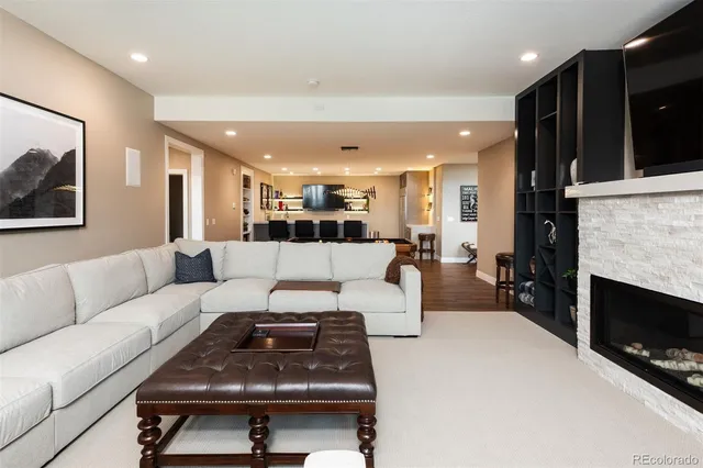 a room with furniture pool table and windows