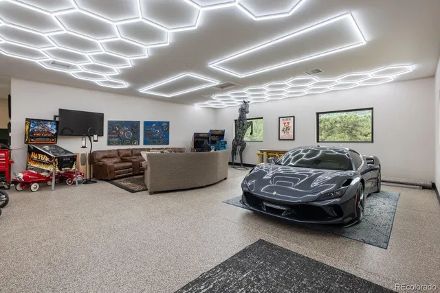 a living room with furniture and large windows