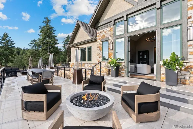 a balcony with furniture and city view