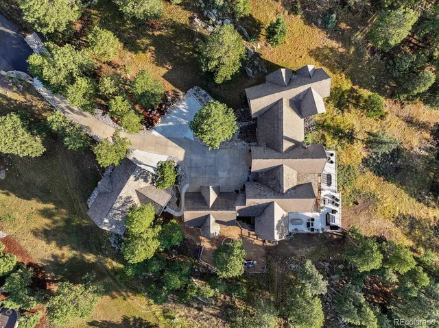 a front view of a house with yard and seating area