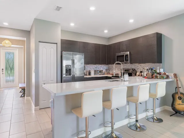 a kitchen with counter top space cabinets and stainless steel appliances