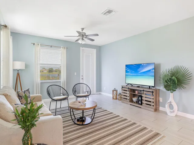 a view of a livingroom with furniture and windows