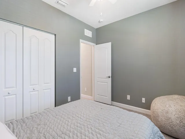 a bedroom with a bed and a bathroom