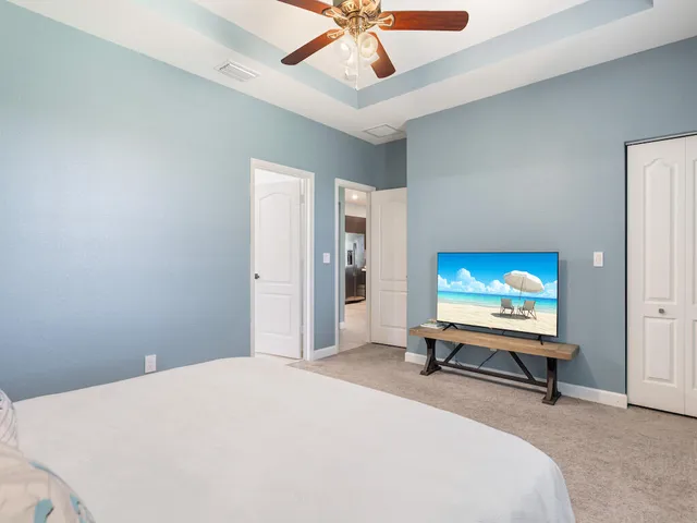 a bedroom with bed and tv
