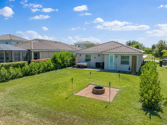 a view of a house with a yard porch and sitting area