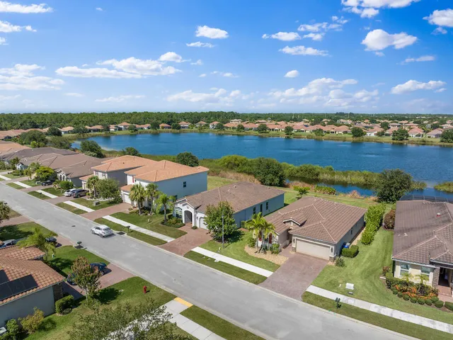 an aerial view of a house with a lake view