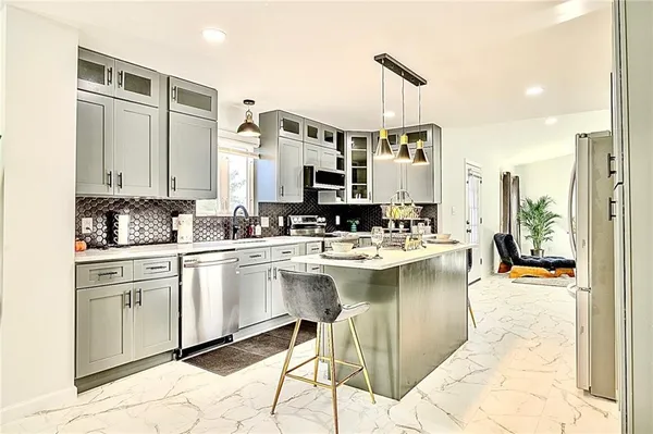 a kitchen with a sink and cabinets