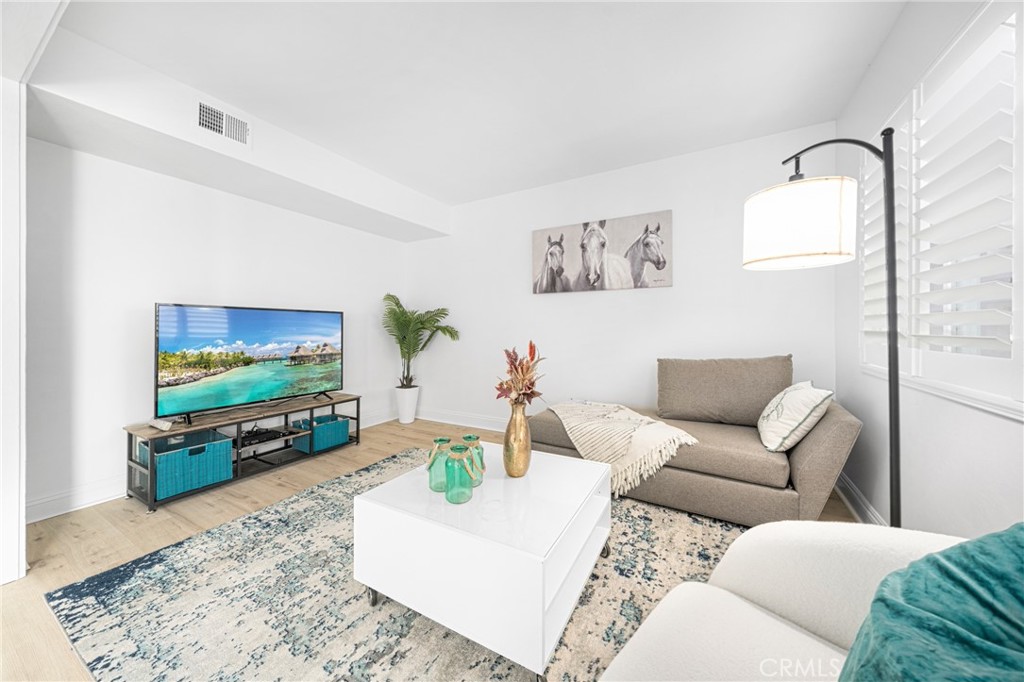 60 Willow Tree Lane Irvine, CA 92612 - Photo 1 of 32 a living room with furniture and a flat screen tv