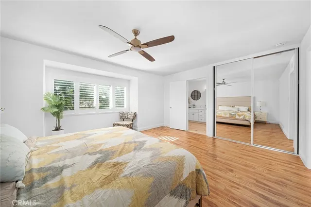 a spacious bedroom with a bed and a window