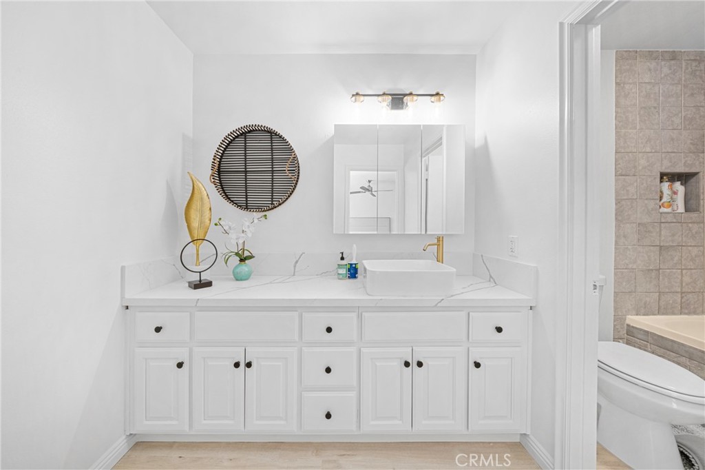 60 Willow Tree Lane Irvine, CA 92612 - Photo 14 of 32 a bathroom with a sink vanity and a mirror