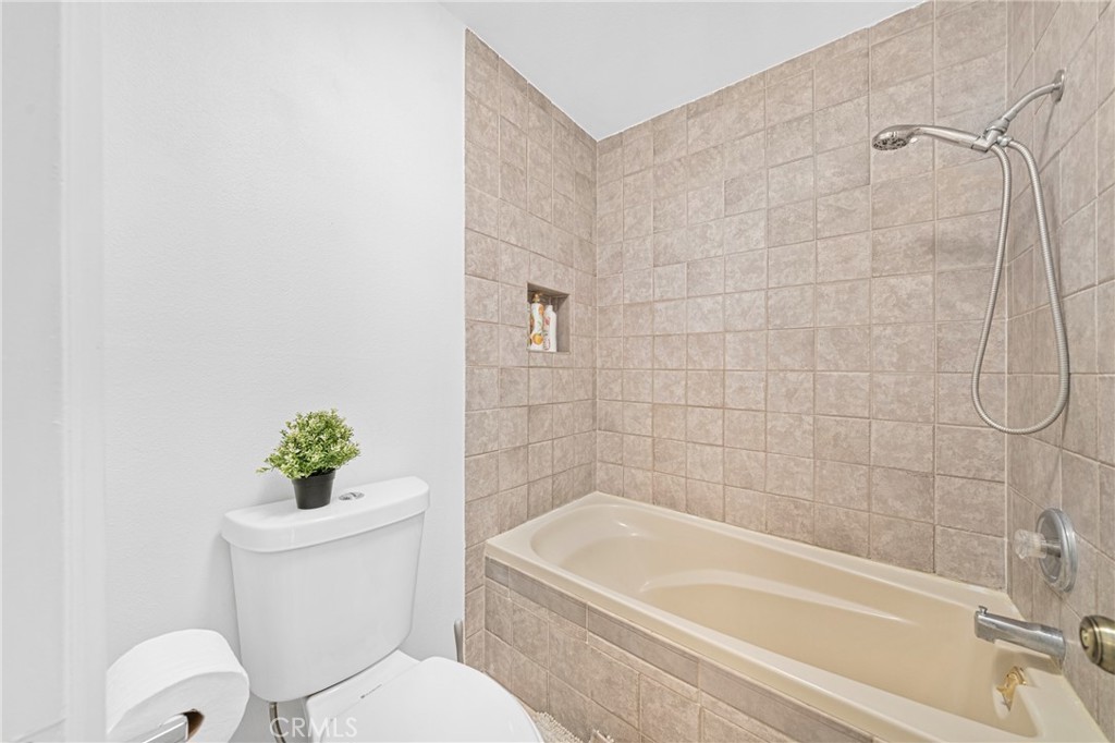 60 Willow Tree Lane Irvine, CA 92612 - Photo 15 of 32 a white toilet sitting next to a bath tub