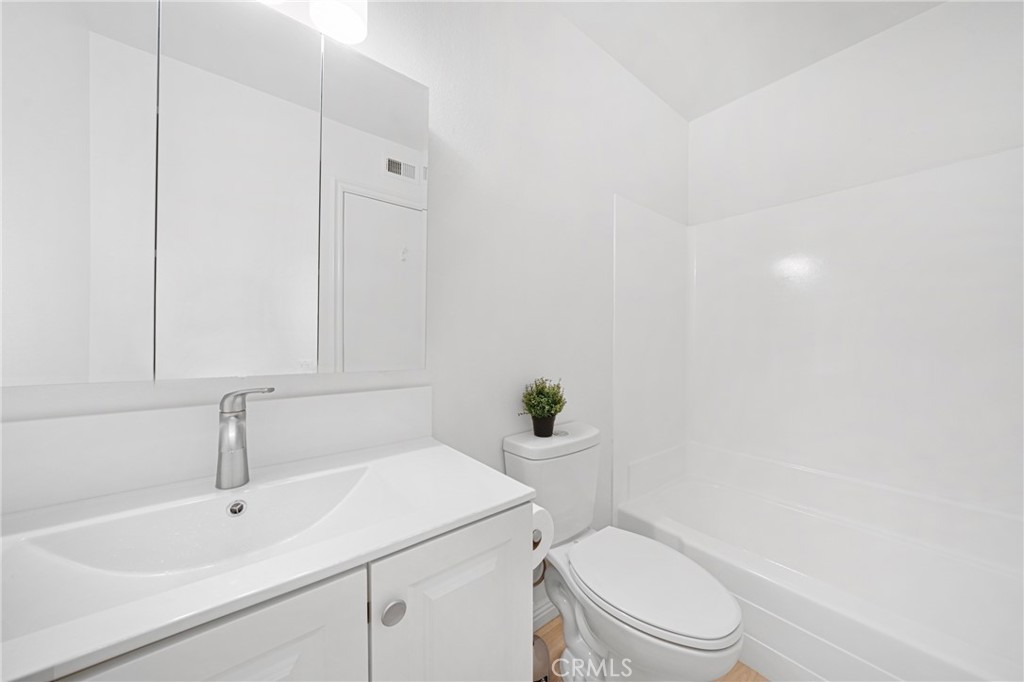 60 Willow Tree Lane Irvine, CA 92612 - Photo 18 of 32 a bathroom with a sink a toilet and shower