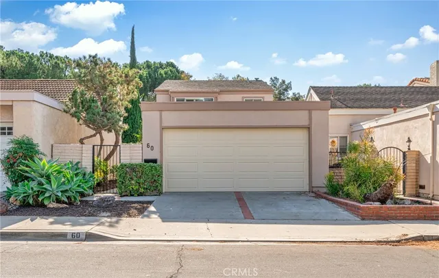 a view of a house with a yard and plants