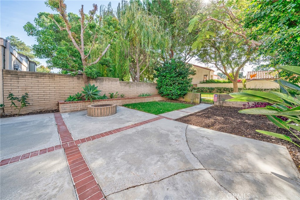 60 Willow Tree Lane Irvine, CA 92612 - Photo 22 of 32 a view of backyard with plants and trees