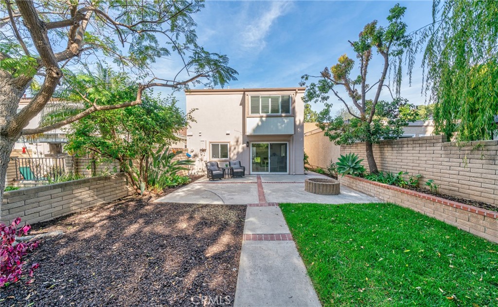 60 Willow Tree Lane Irvine, CA 92612 - Photo 23 of 32 a view of a yard with a patio