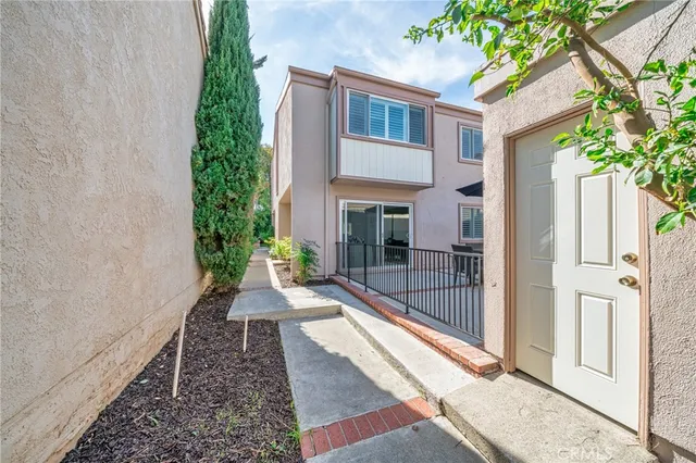 a front view of a house with a yard and a garage