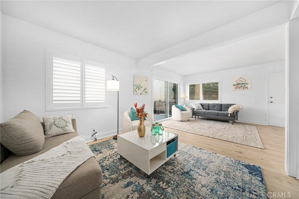 60 Willow Tree Lane Irvine, CA 92612 - Photo 3 of 32 a living room with furniture and a large window