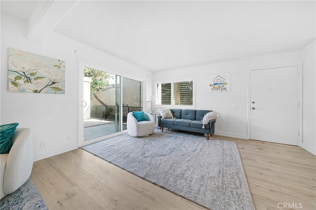 60 Willow Tree Lane Irvine, CA 92612 - Photo 6 of 32 a living room with furniture and a window