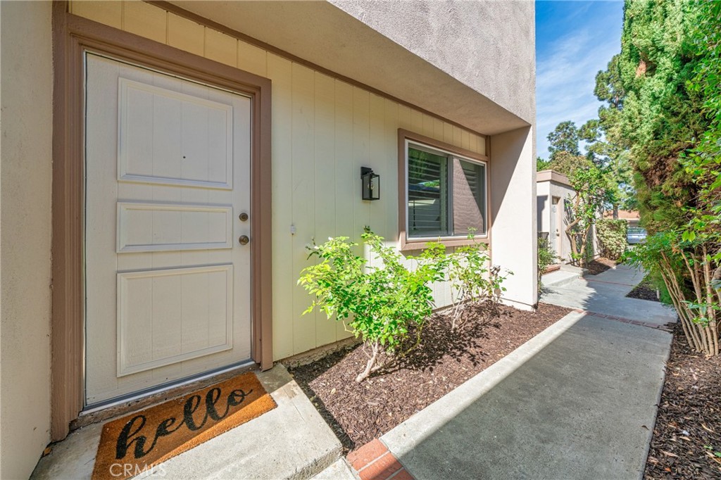 60 Willow Tree Lane Irvine, CA 92612 - Photo 10 of 32 a front view of a house with a yard