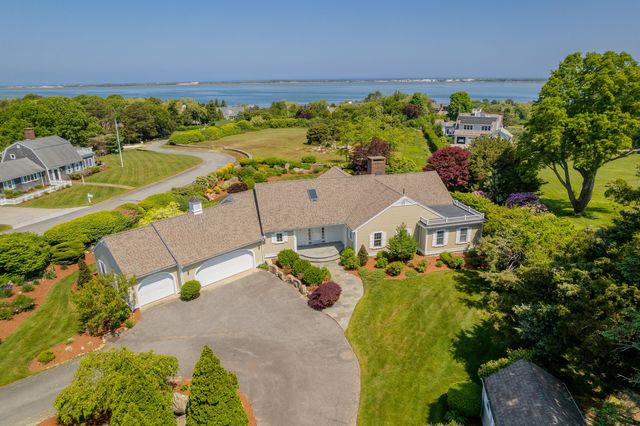 an aerial view of a house with a swimming pool yard and outdoor seating