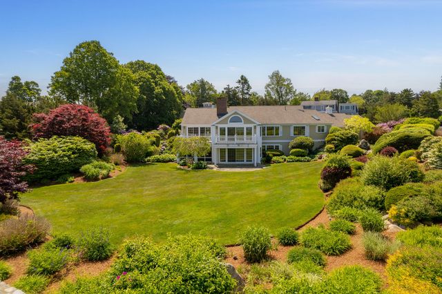 an aerial view of a residential houses with outdoor space and swimming pool