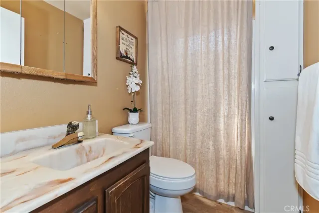 a bedroom with two beds and large window
