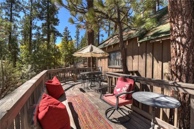 a view of a balcony with furniture