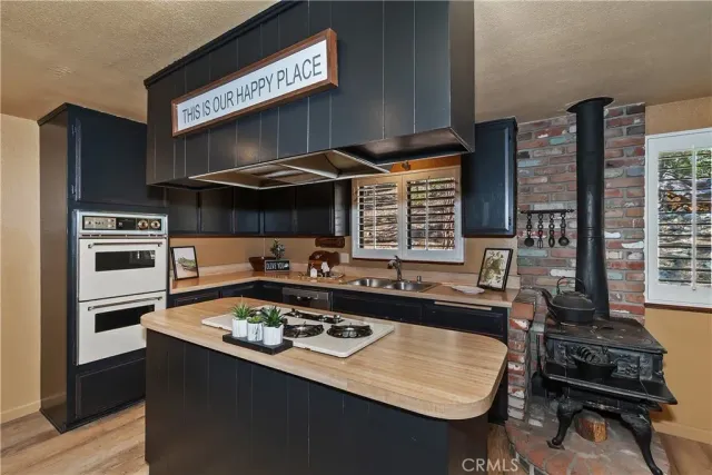 a kitchen with a stove and a refrigerator