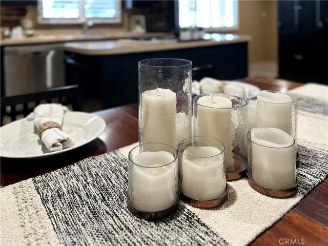a kitchen with a table and chairs