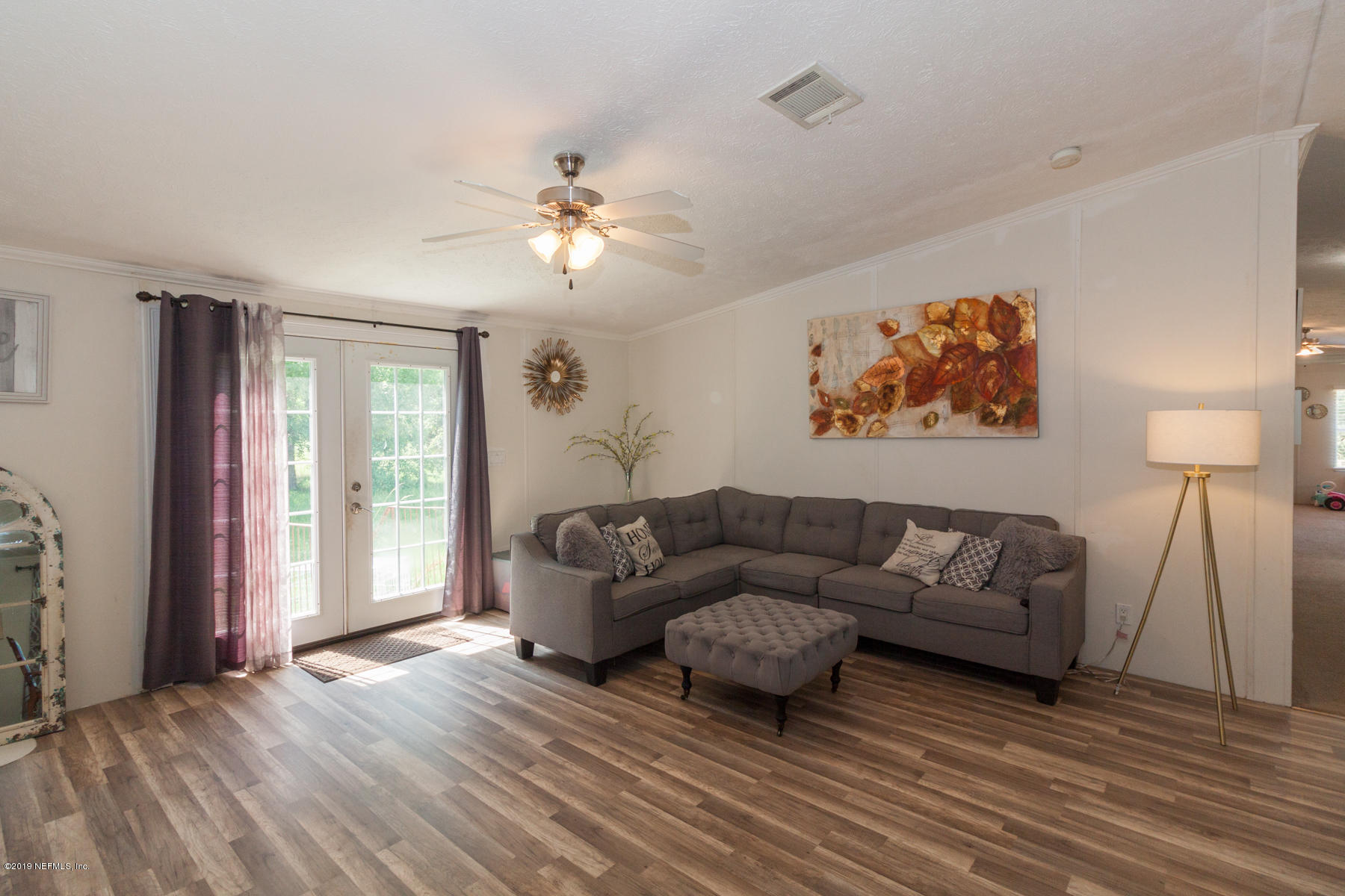 55154 Spencerville Road Callahan, FL 32011 - Photo 3 of 23 a living room with furniture and a window