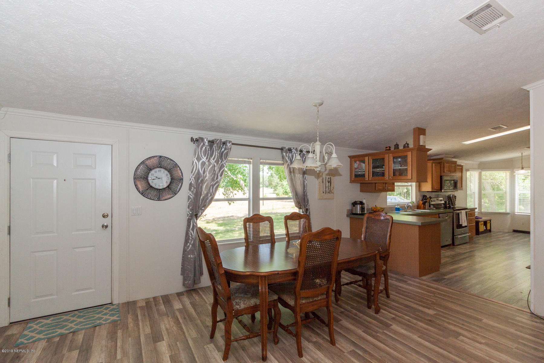 55154 Spencerville Road Callahan, FL 32011 - Photo 4 of 23 a view of a dining room with furniture and window