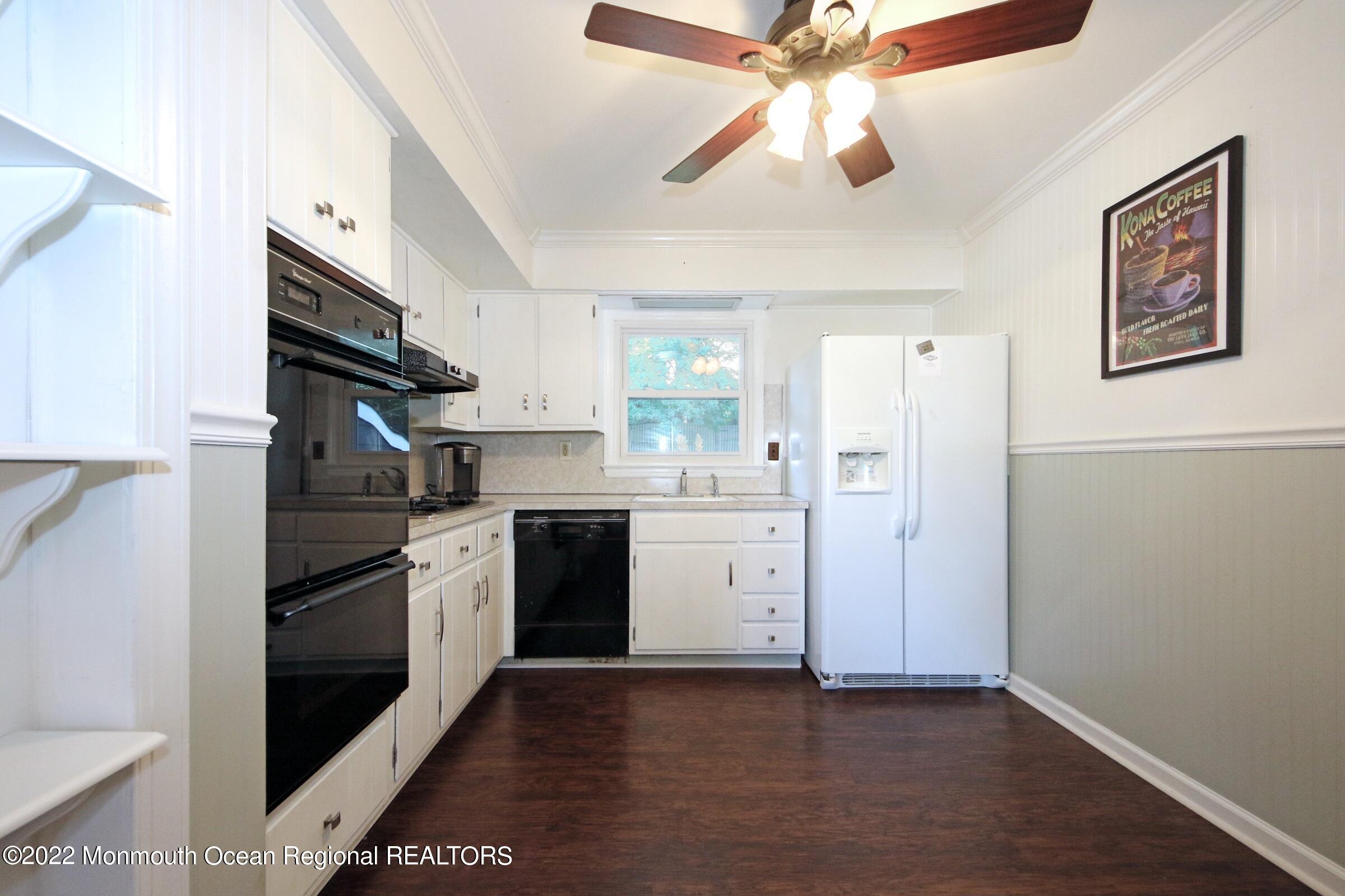 18 Crestview Drive Middletown, NJ 07748 - Photo 12 of 20 a kitchen with stainless steel appliances granite countertop a refrigerator and a stove top oven
