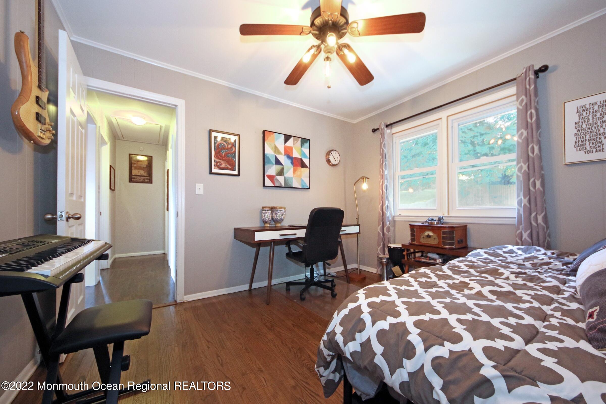 18 Crestview Drive Middletown, NJ 07748 - Photo 19 of 20 a bedroom with a bed and a window