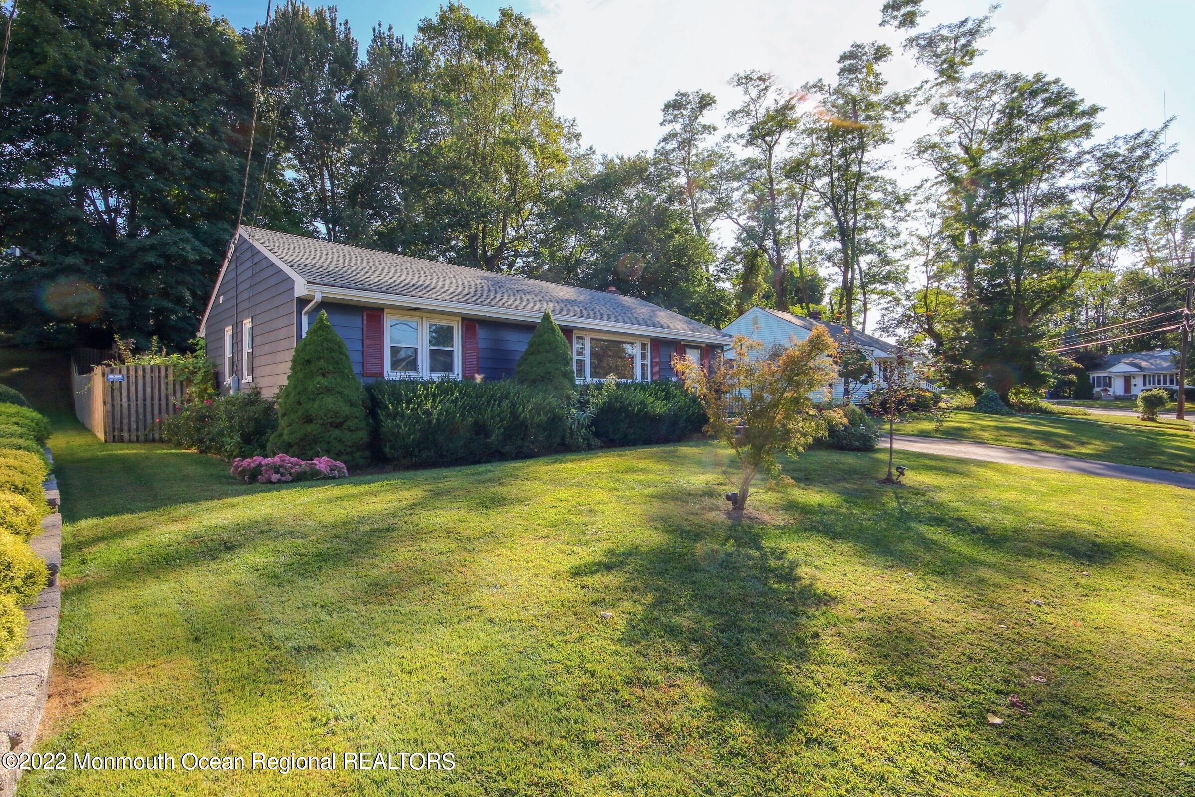 18 Crestview Drive Middletown, NJ 07748 - Photo 2 of 20 a view of a house with pool and a garden