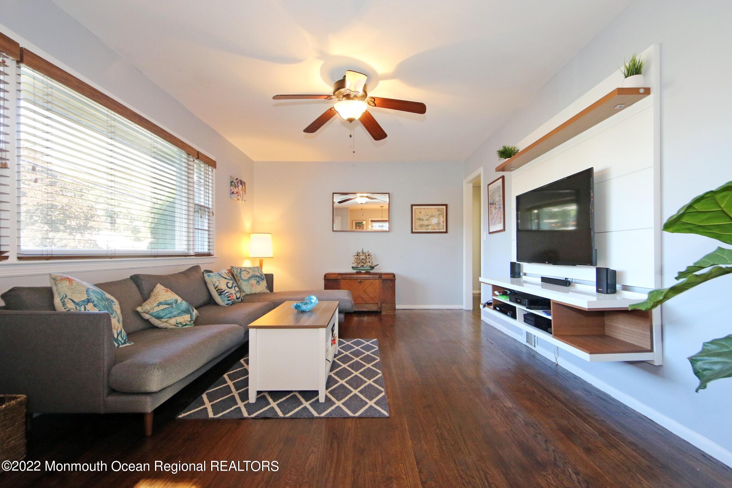 18 Crestview Drive Middletown, NJ 07748 - Photo 7 of 20 a living room with furniture and a flat screen tv