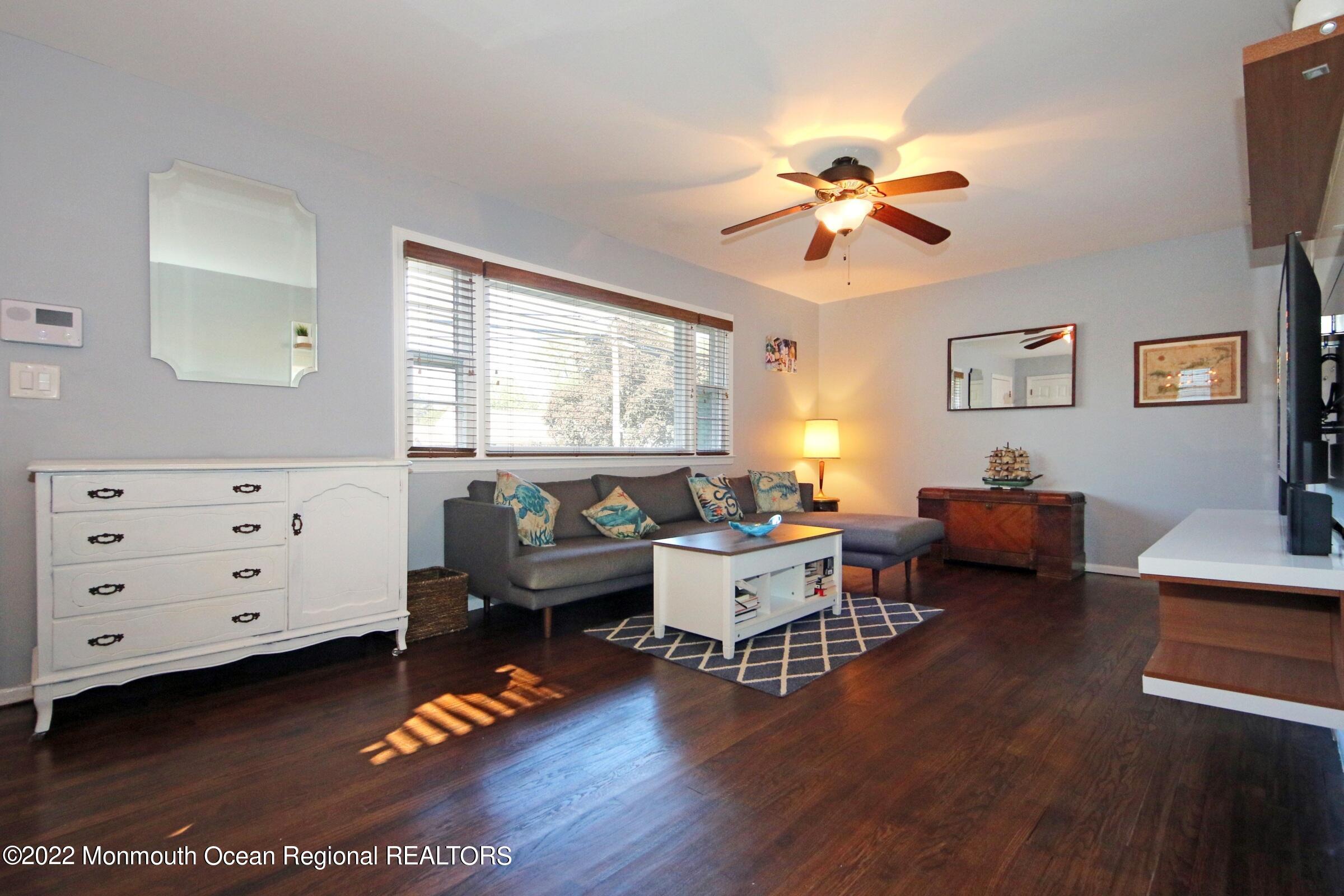 18 Crestview Drive Middletown, NJ 07748 - Photo 8 of 20 a living room with furniture and wooden floor