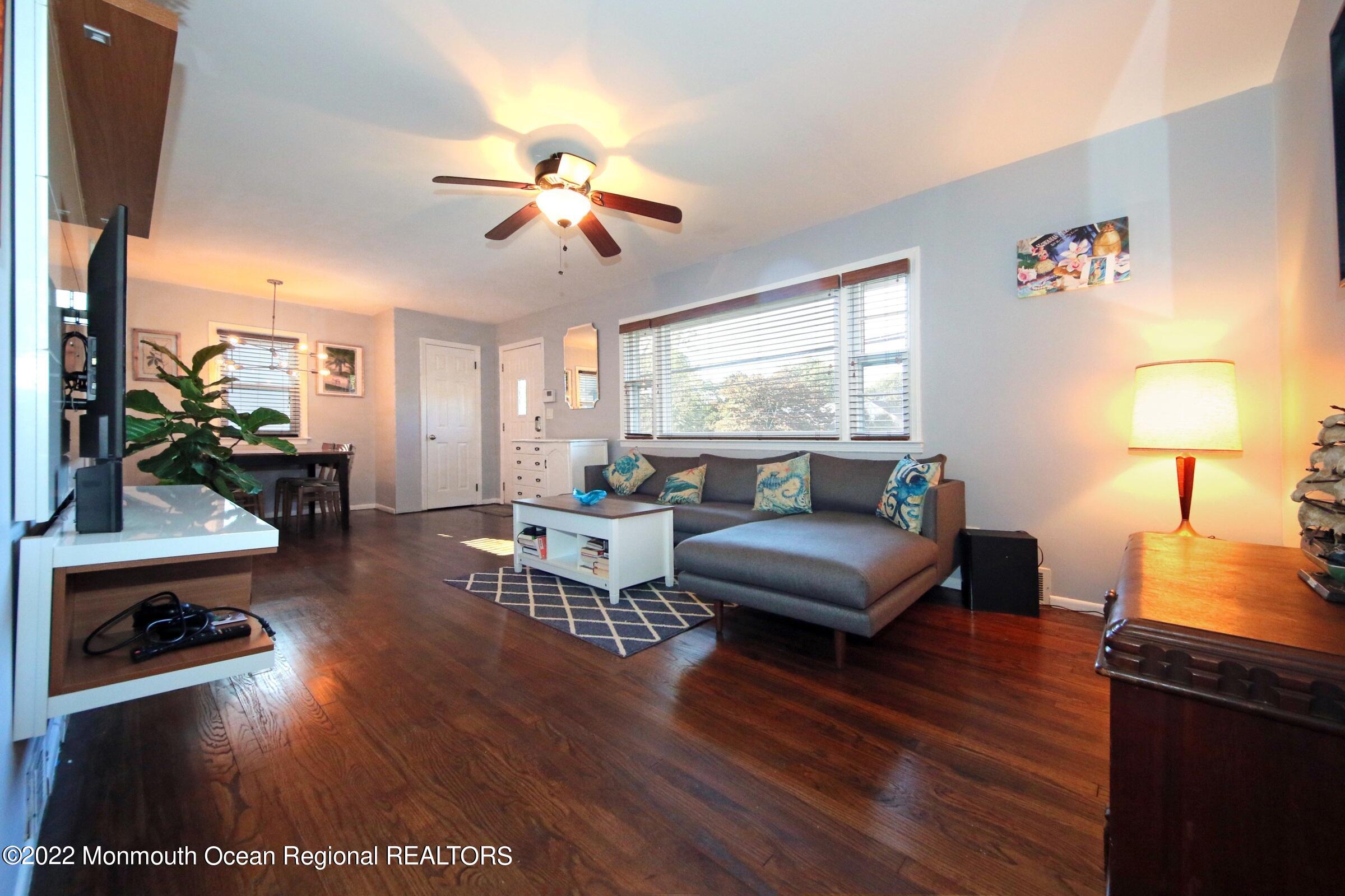 18 Crestview Drive Middletown, NJ 07748 - Photo 9 of 20 a living room with furniture and a fireplace
