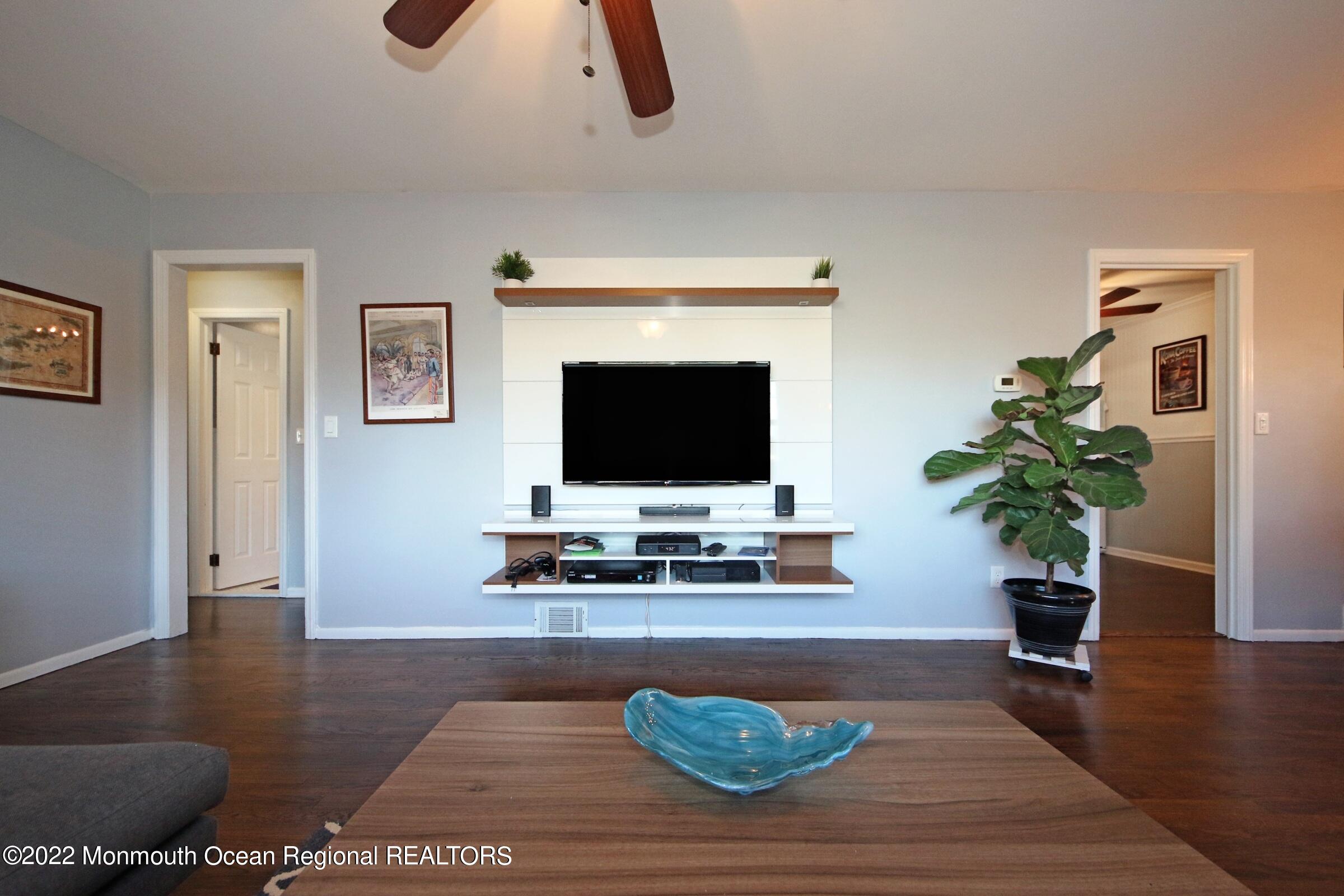 18 Crestview Drive Middletown, NJ 07748 - Photo 10 of 20 a living room with furniture and a flat screen tv