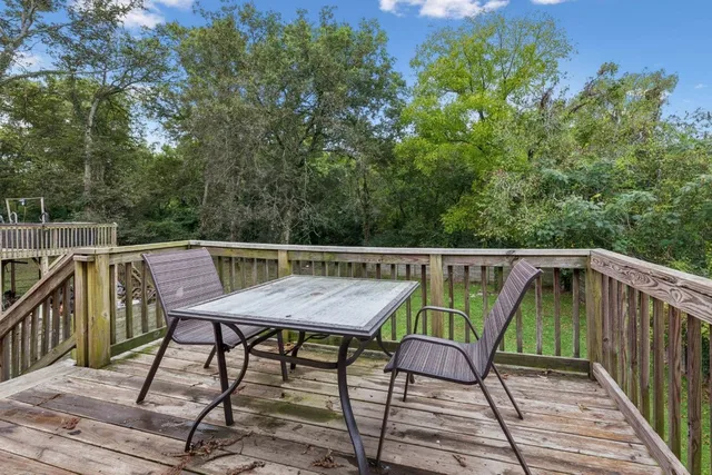 a view of a backyard with swimming pool