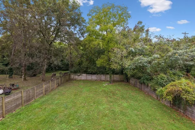 a view of a backyard with a trampoline