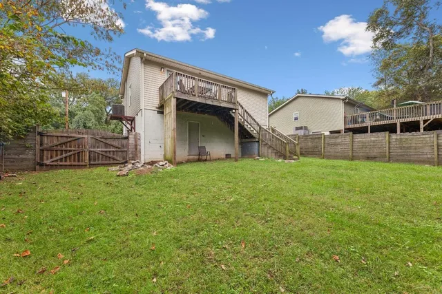 a view of a house with a backyard
