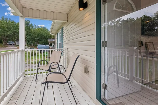 a view of a balcony with furniture