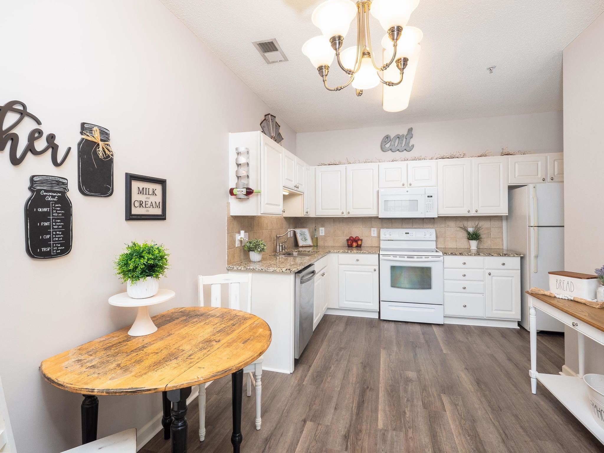 2511 Huntscroft Lane, Unit 201 Raleigh, NC 27617 - Photo 6 of 34 a kitchen with a table and chairs