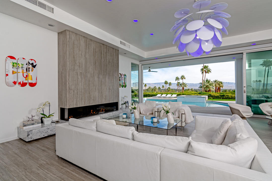 70288 Pecos Road Rancho Mirage, CA 92270 - Photo 17 of 76 a living room with furniture and a floor to ceiling window