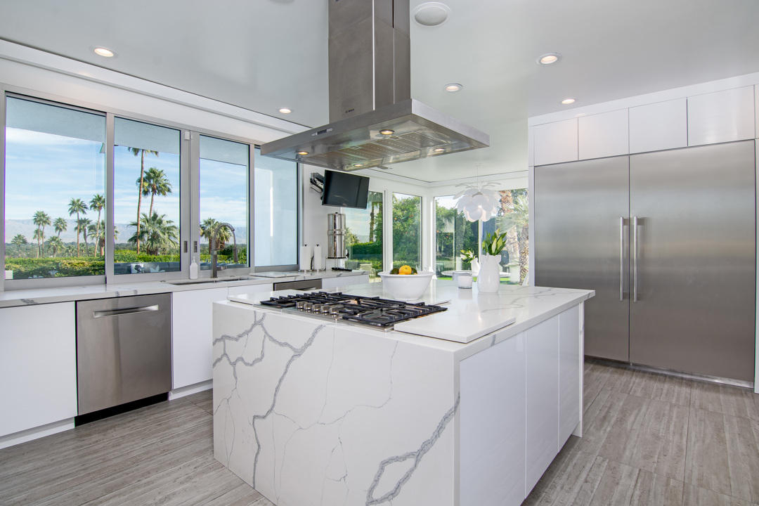 70288 Pecos Road Rancho Mirage, CA 92270 - Photo 30 of 76 a kitchen with stainless steel appliances granite countertop a sink and a refrigerator