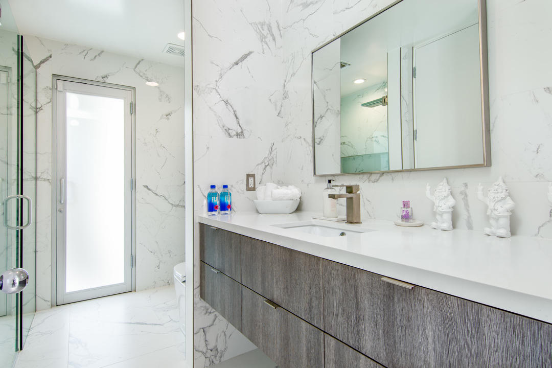 70288 Pecos Road Rancho Mirage, CA 92270 - Photo 36 of 76 a bathroom with a sink vanity and a mirror