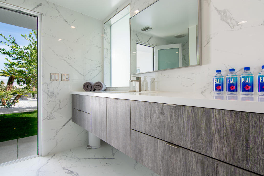 70288 Pecos Road Rancho Mirage, CA 92270 - Photo 39 of 76 a bathroom with a sink and a mirror