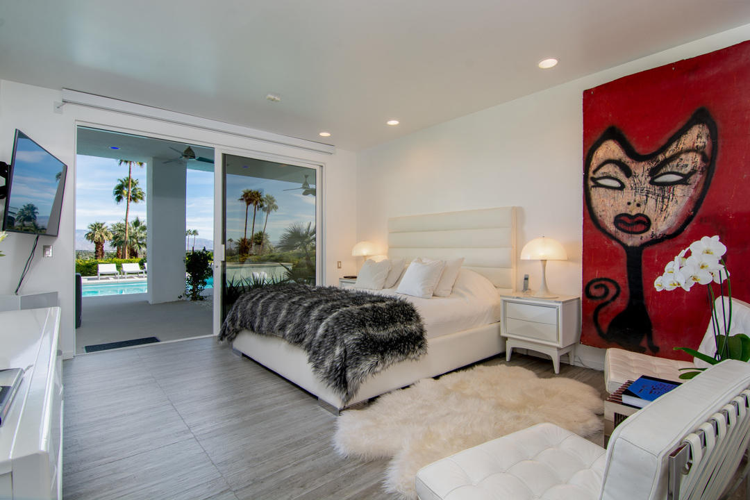 70288 Pecos Road Rancho Mirage, CA 92270 - Photo 43 of 76 a spacious bedroom with a bed and window