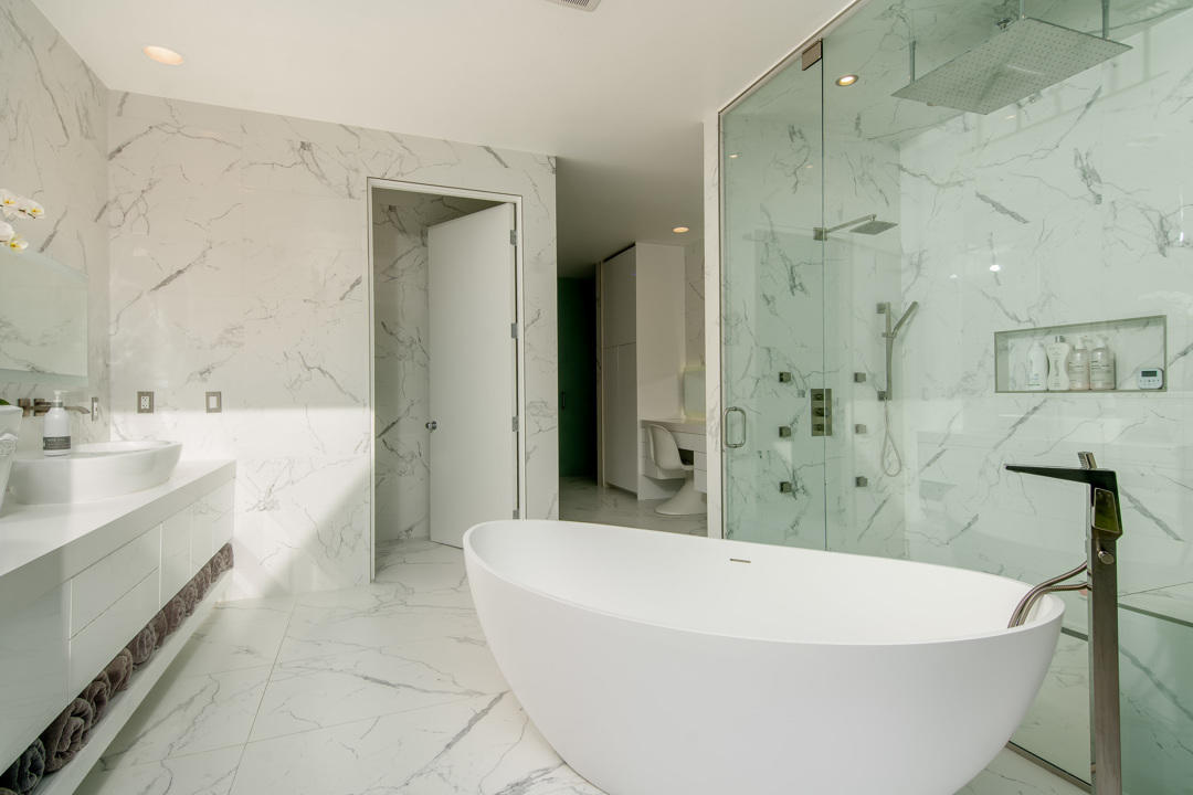 70288 Pecos Road Rancho Mirage, CA 92270 - Photo 48 of 76 a white bath tub sitting in a bathroom and shower