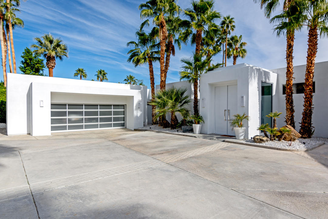 70288 Pecos Road Rancho Mirage, CA 92270 - Photo 76 of 76 a view of a house with a yard and garage